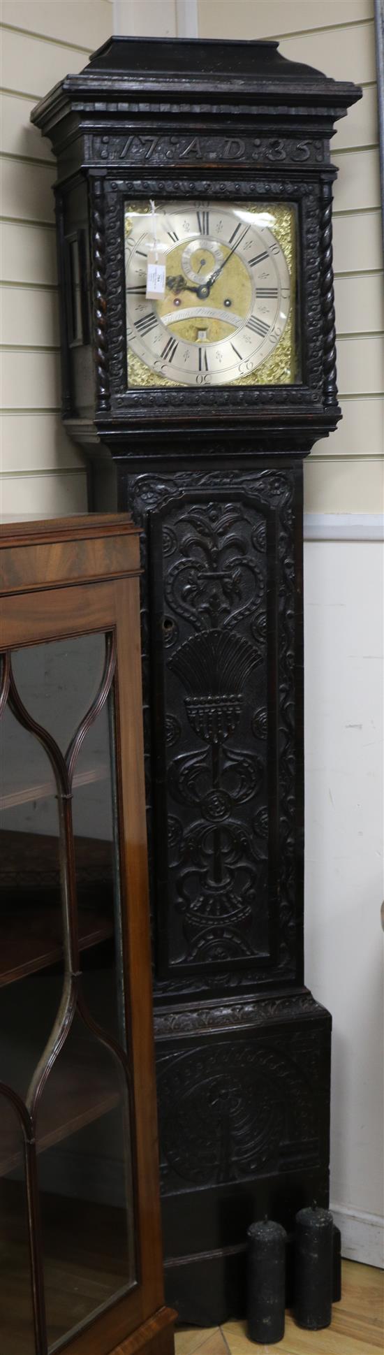 Thomas Pierce of Bristol. A George III eight day longcase clock, in a carved oak case bearing the date 1735